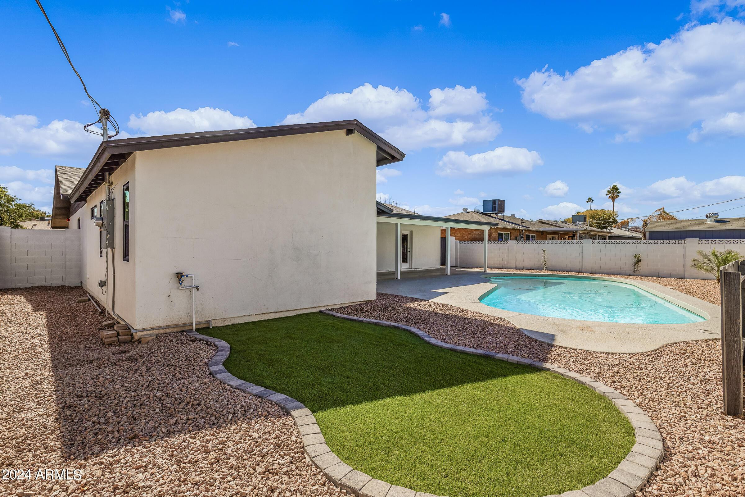 7308 East Granada Road Scottsdale, AZ 85257 - Photo 36 of 39 a view of a backyard with white house