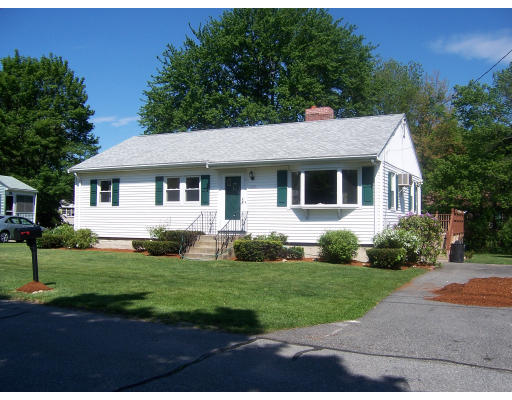 10 Melo Road Woburn, MA 01801 - Photo 1 of 3 a front view of a house with a yard