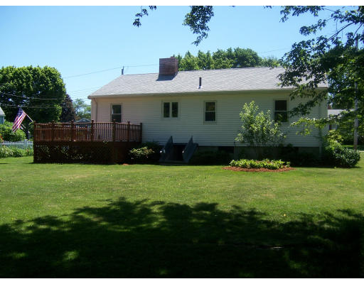 10 Melo Road Woburn, MA 01801 - Photo 3 of 3 a front view of a house with a garden