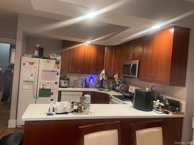 33 Virginia Avenue Poughkeepsie, NY 12601 - Photo 5 of 11 a kitchen with a sink a stove and chairs