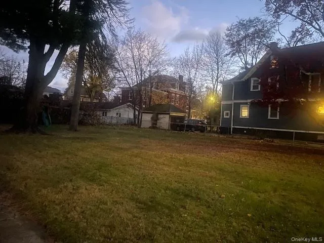 a view of a yard with a table and chair