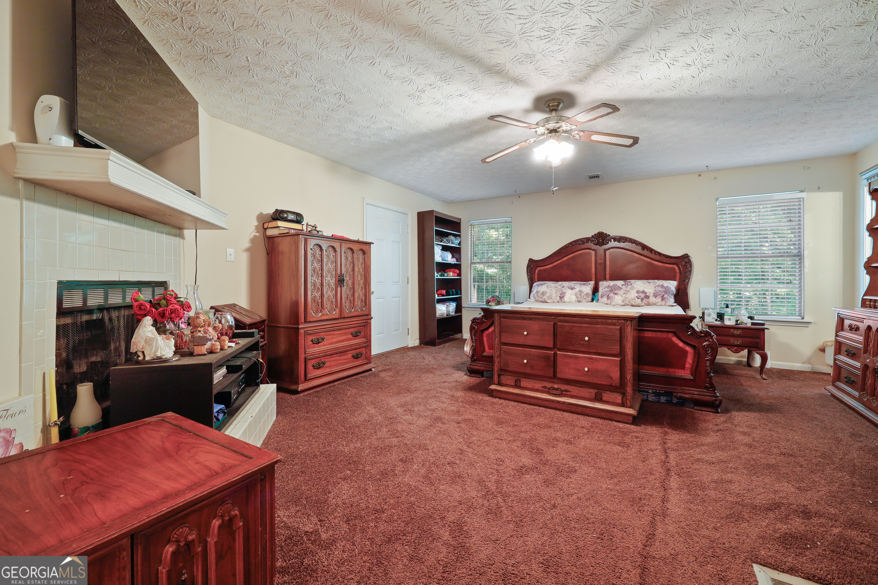 2433 Bear Creek Road Statham, GA 30666 - Photo 20 of 58 a bedroom with furniture and window