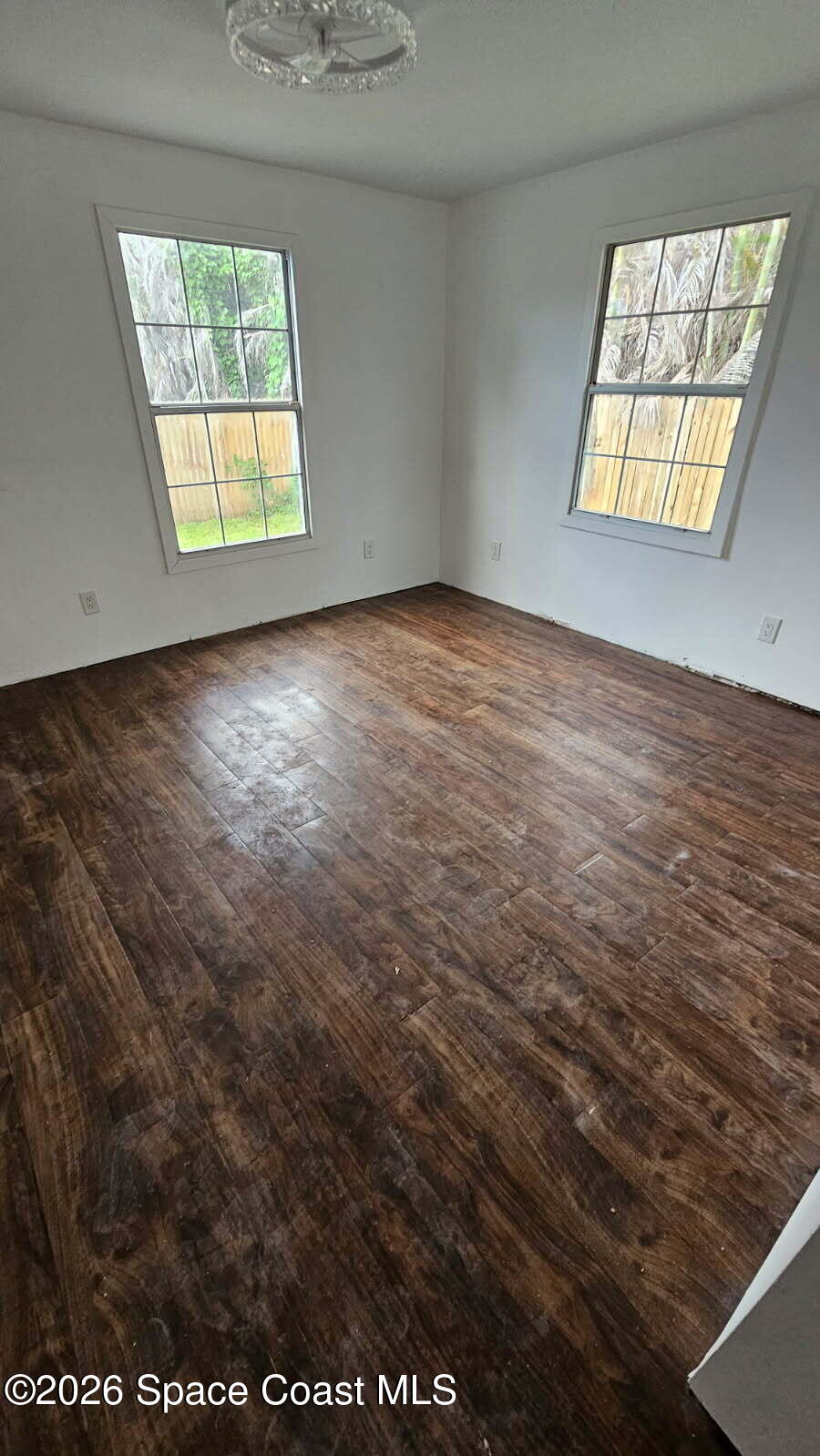 1925 Monticello Avenue Merritt Island, FL 32952 - Photo 11 of 17 an empty room with windows
