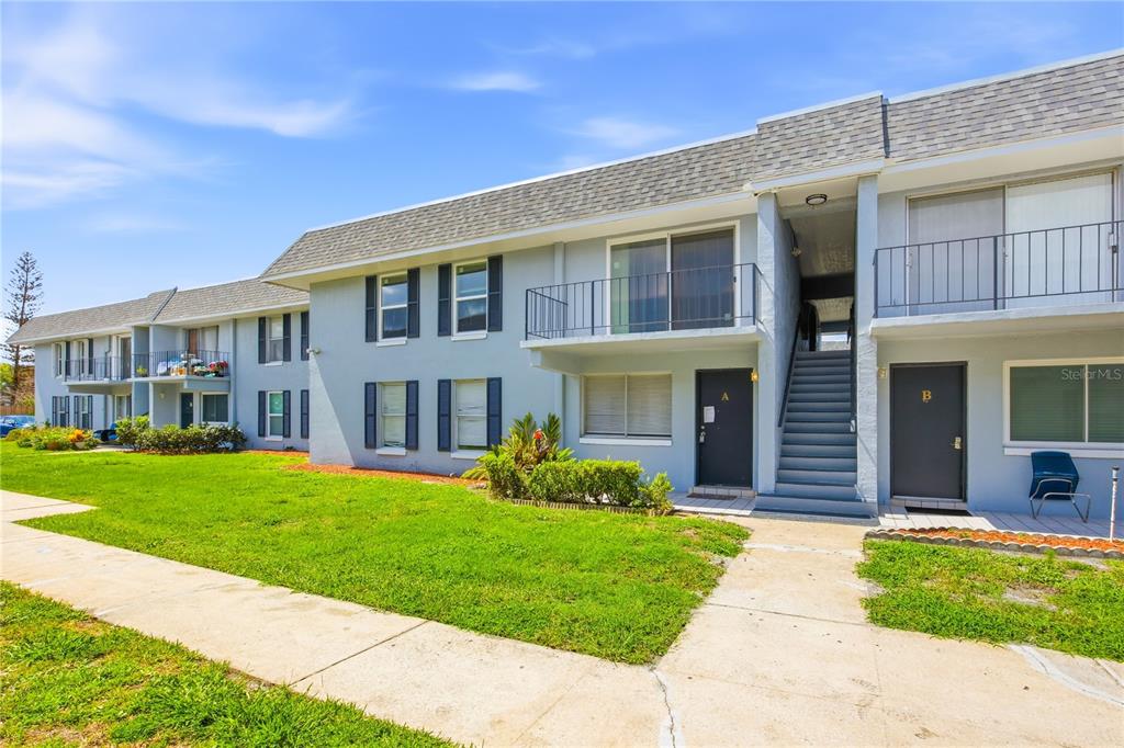925 West Oak Ridge Road, Unit 925C Orlando, FL 32809 - Photo 1 of 15 a front view of a house with a yard