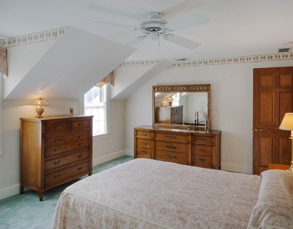3 Turnburry Hill Road, Unit 3 Lexington, MA 02421 - Photo 12 of 14 a bedroom with a bed and furniture