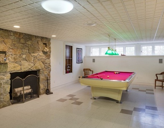 3 Turnburry Hill Road, Unit 3 Lexington, MA 02421 - Photo 13 of 14 a room with furniture and a fireplace