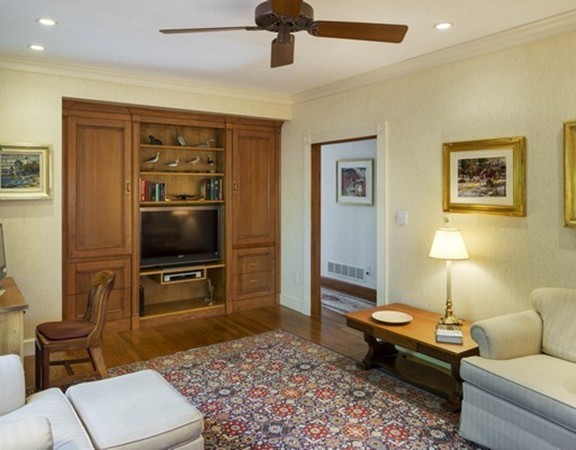 3 Turnburry Hill Road, Unit 3 Lexington, MA 02421 - Photo 8 of 14 a living room with furniture and a flat screen tv