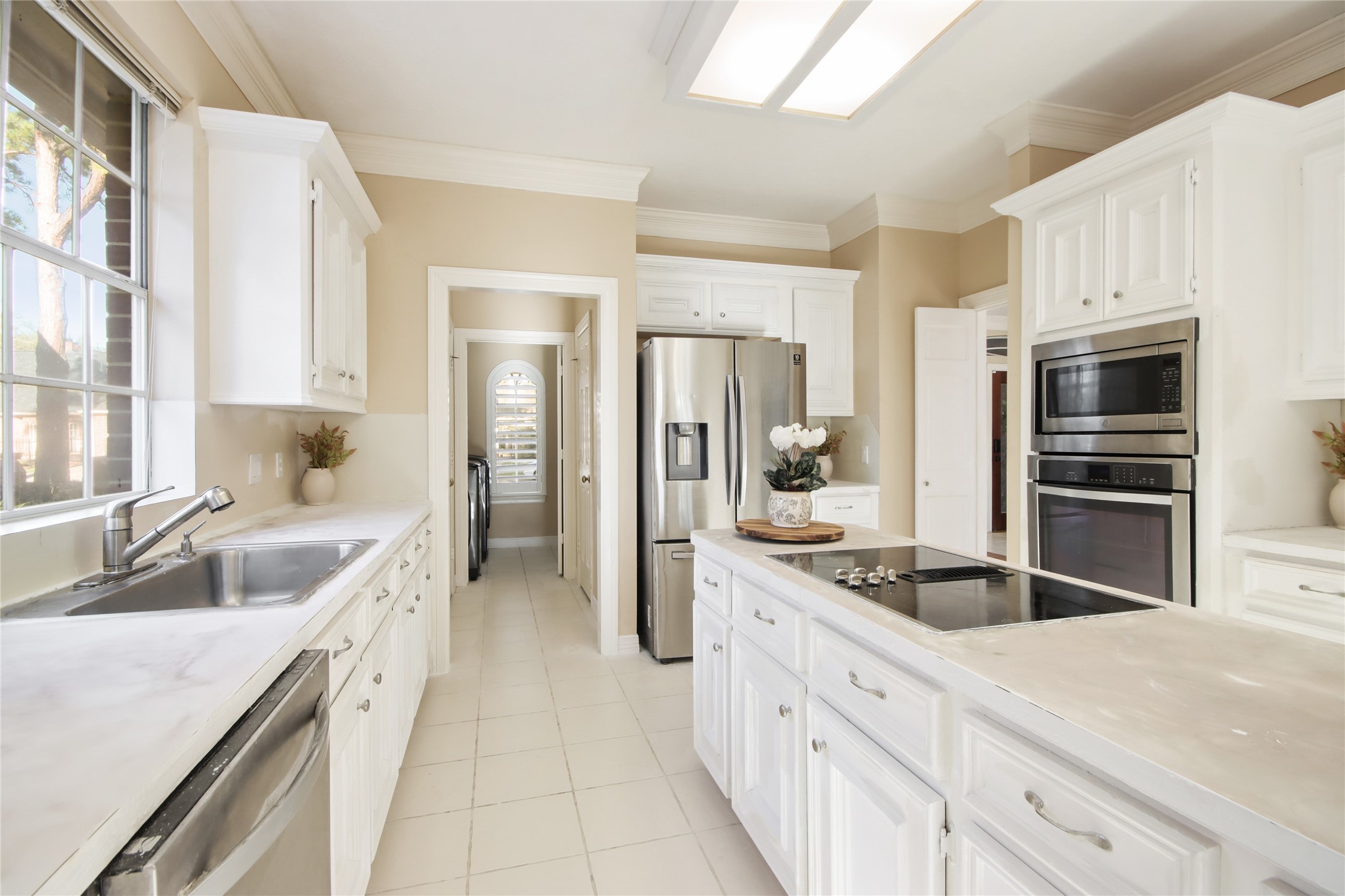 8411 Rockford Hall Drive Spring, TX 77379 - Photo 8 of 32 A closer look at the kitchen reveals thoughtful design and refined finishes, with generous counter space, abundant cabinetry, and a layout that supports both everyday functionality and effortless entertaining.