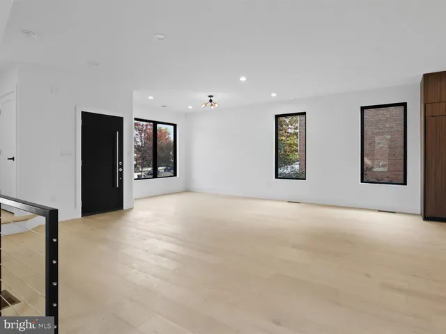 a kitchen with granite countertop a sink and stove top oven