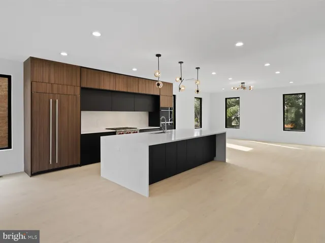 a bathroom with a toilet a sink and shower