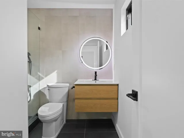 a view of entryway with wooden floor and stairs