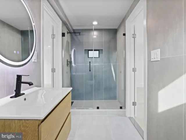 a picture of a bench in front of a wall