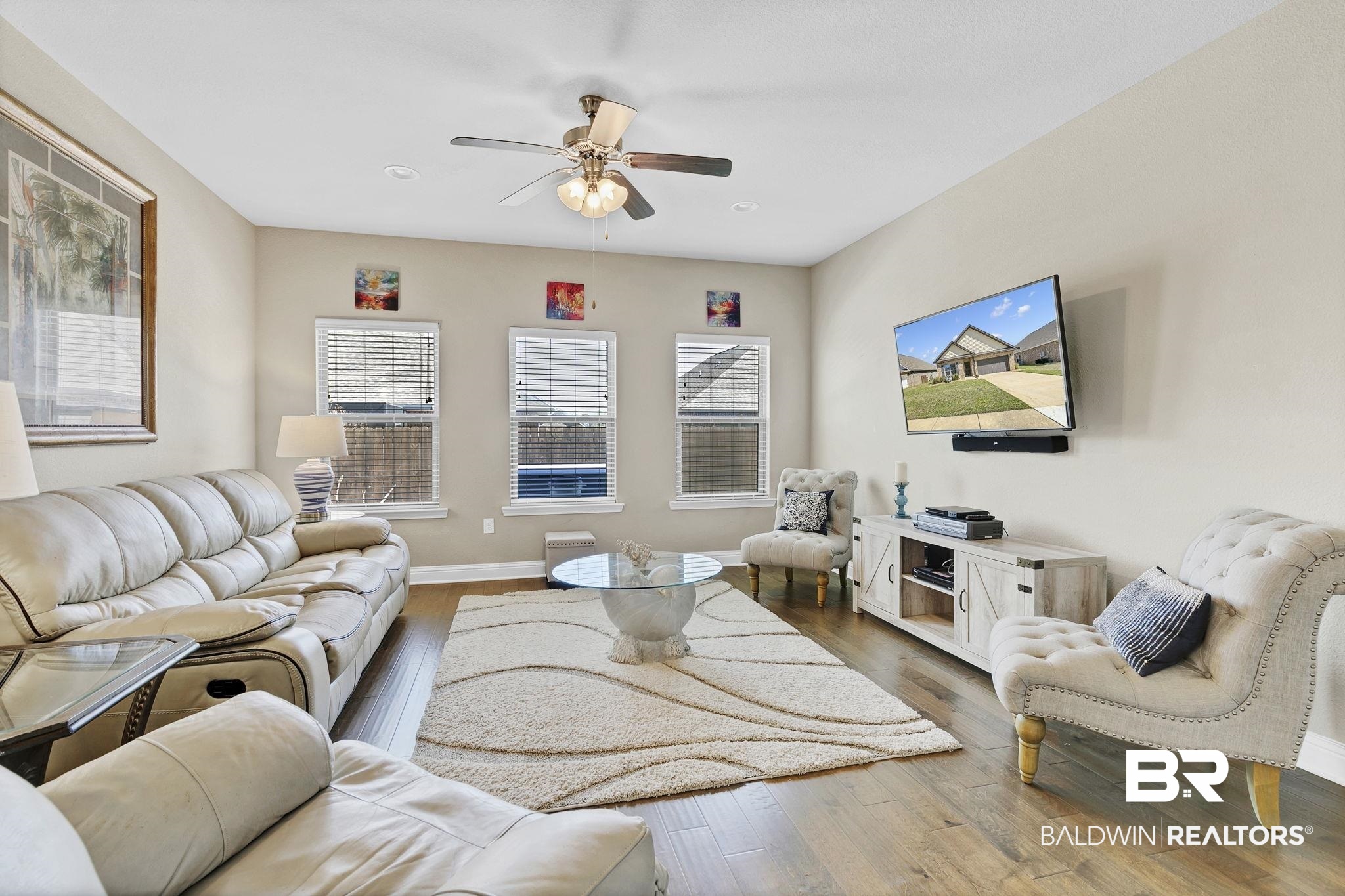 1547 Kairos Loop Foley, AL 36535 - Photo 5 of 55 Living room with a ceiling fan, baseboards, and hardwood / wood-style floors