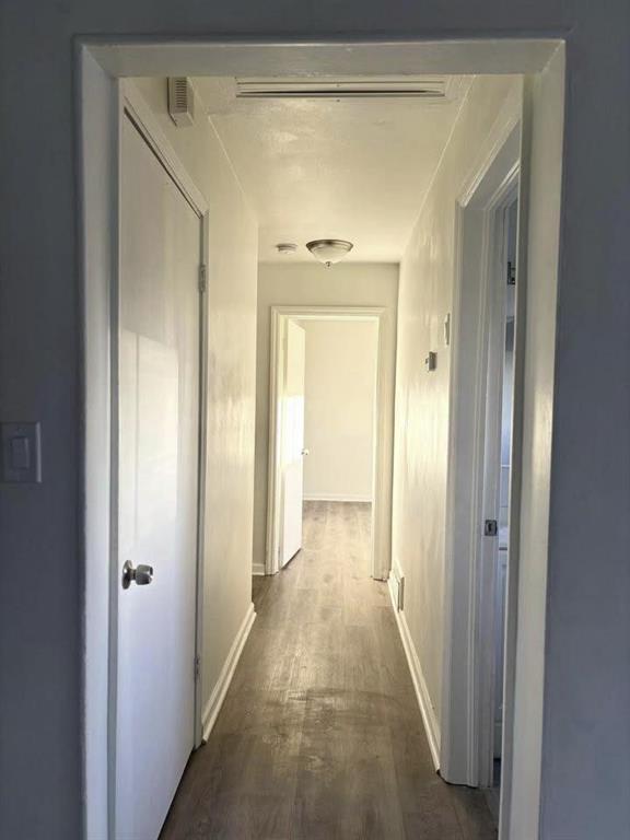 3443 Hyland Drive Decatur, GA 30032 - Photo 19 of 23 a view of a hallway with a wooden door