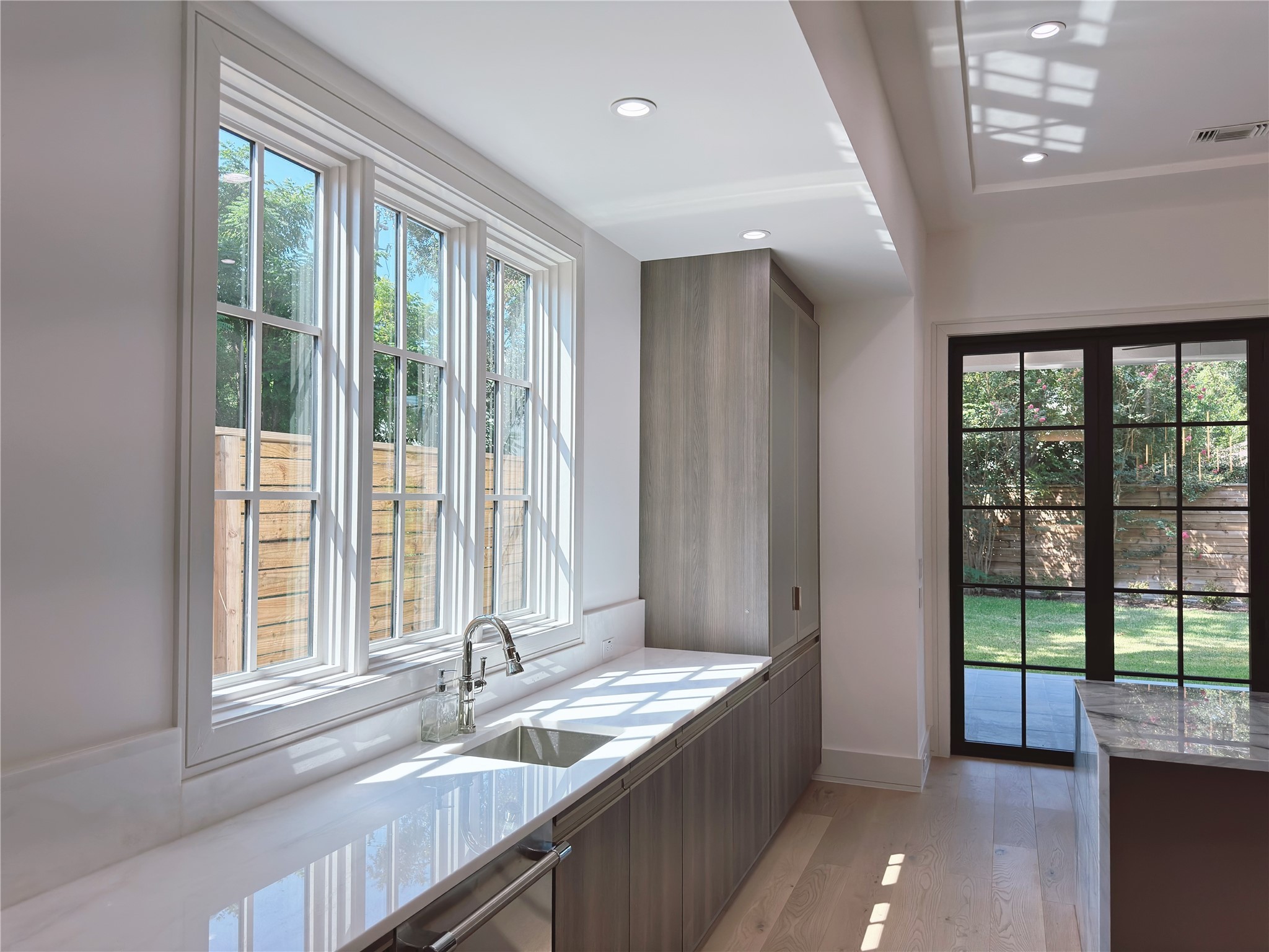 3818 Drake Street Houston, TX 77005 - Photo 13 of 31 a kitchen with granite countertop a sink and a large window