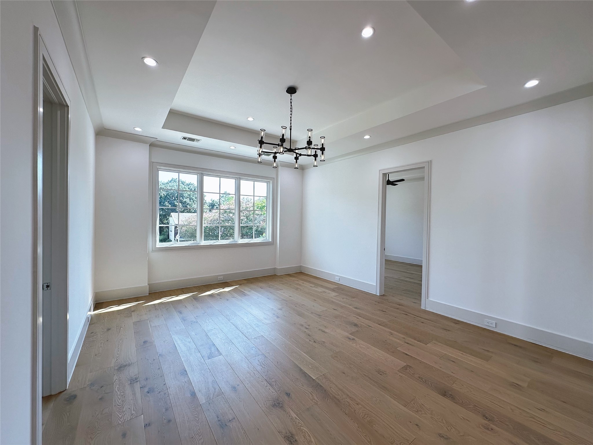 3818 Drake Street Houston, TX 77005 - Photo 19 of 31 wooden floor in an empty room with a window