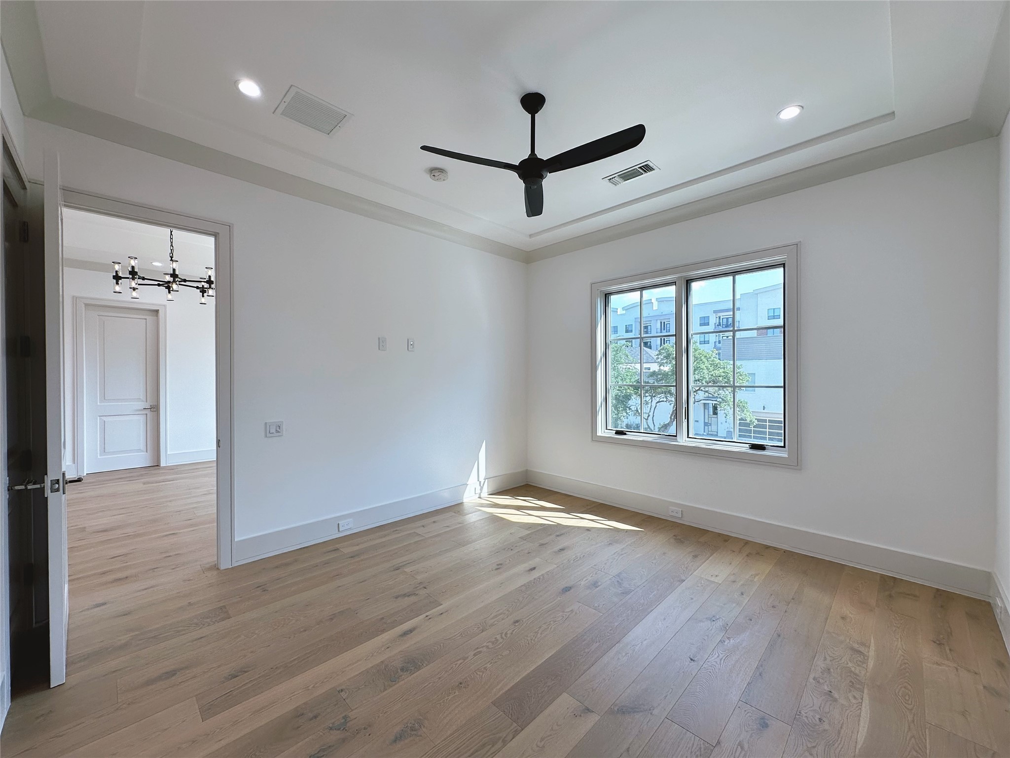 3818 Drake Street Houston, TX 77005 - Photo 23 of 31 wooden floor in an empty room with a window
