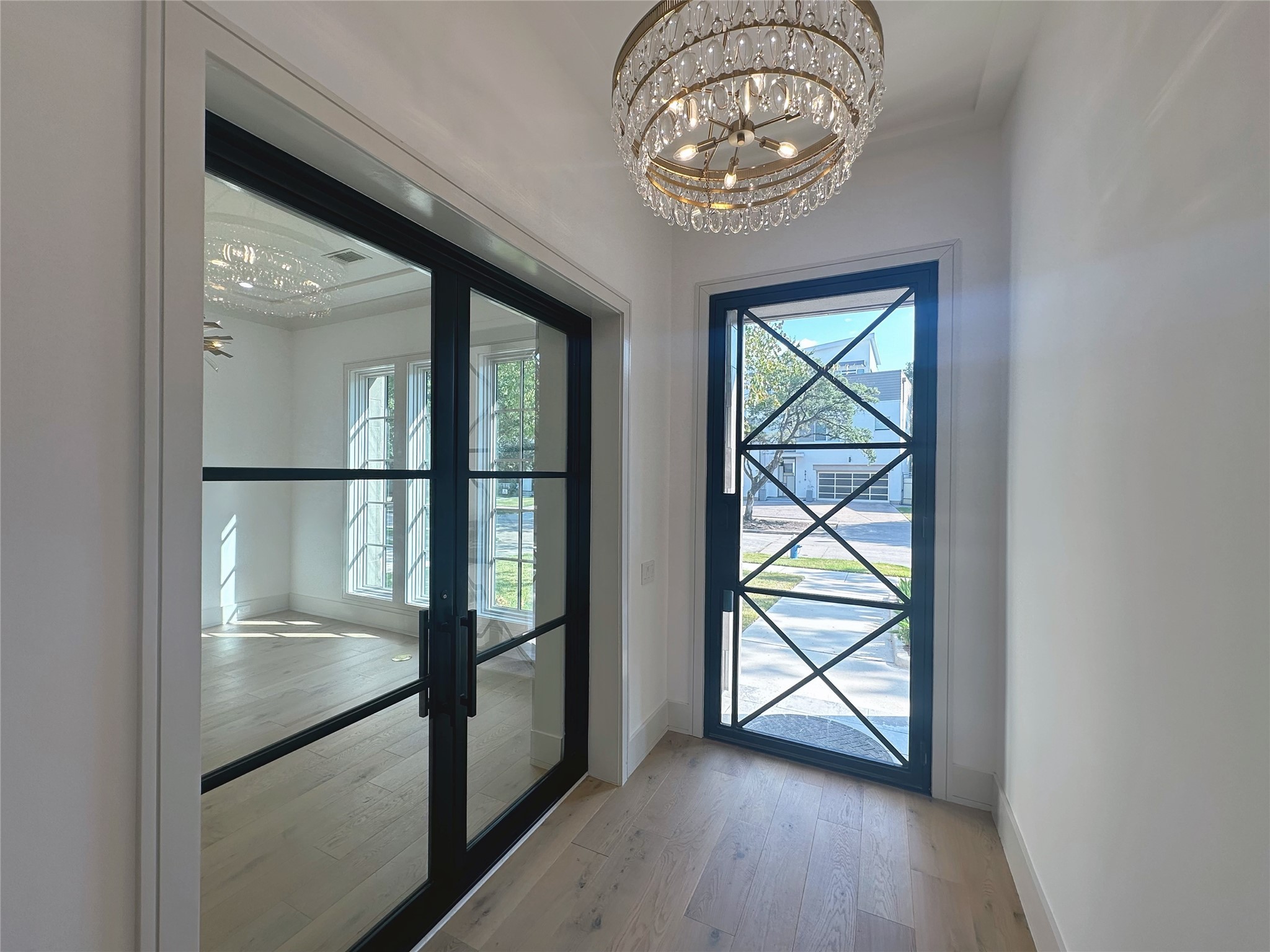 3818 Drake Street Houston, TX 77005 - Photo 3 of 31 an empty room with wooden floor fan and windows