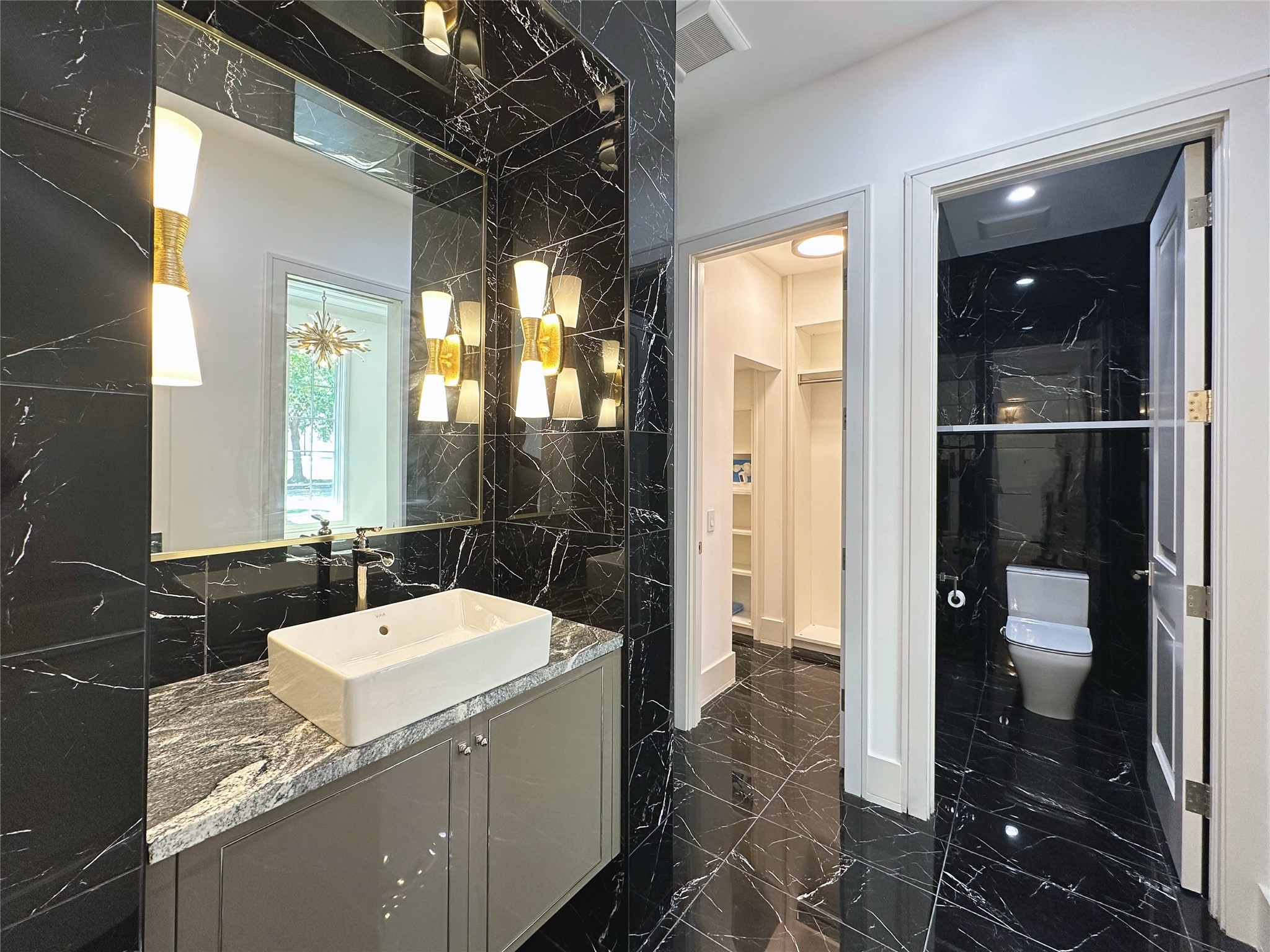 3818 Drake Street Houston, TX 77005 - Photo 5 of 31 a bathroom with a sink and a mirror