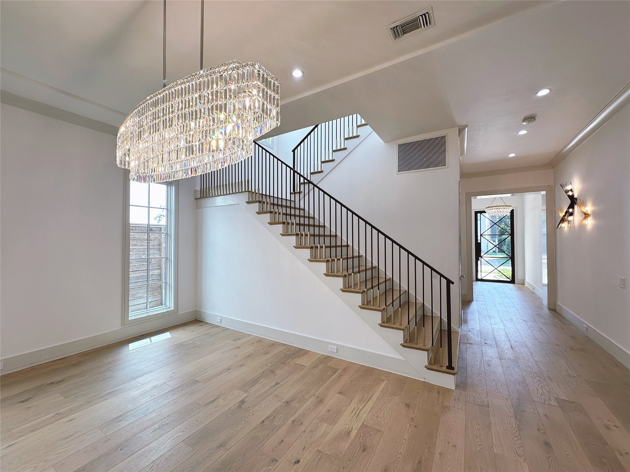 3818 Drake Street Houston, TX 77005 - Photo 6 of 31 a view of entryway and hall with wooden floor