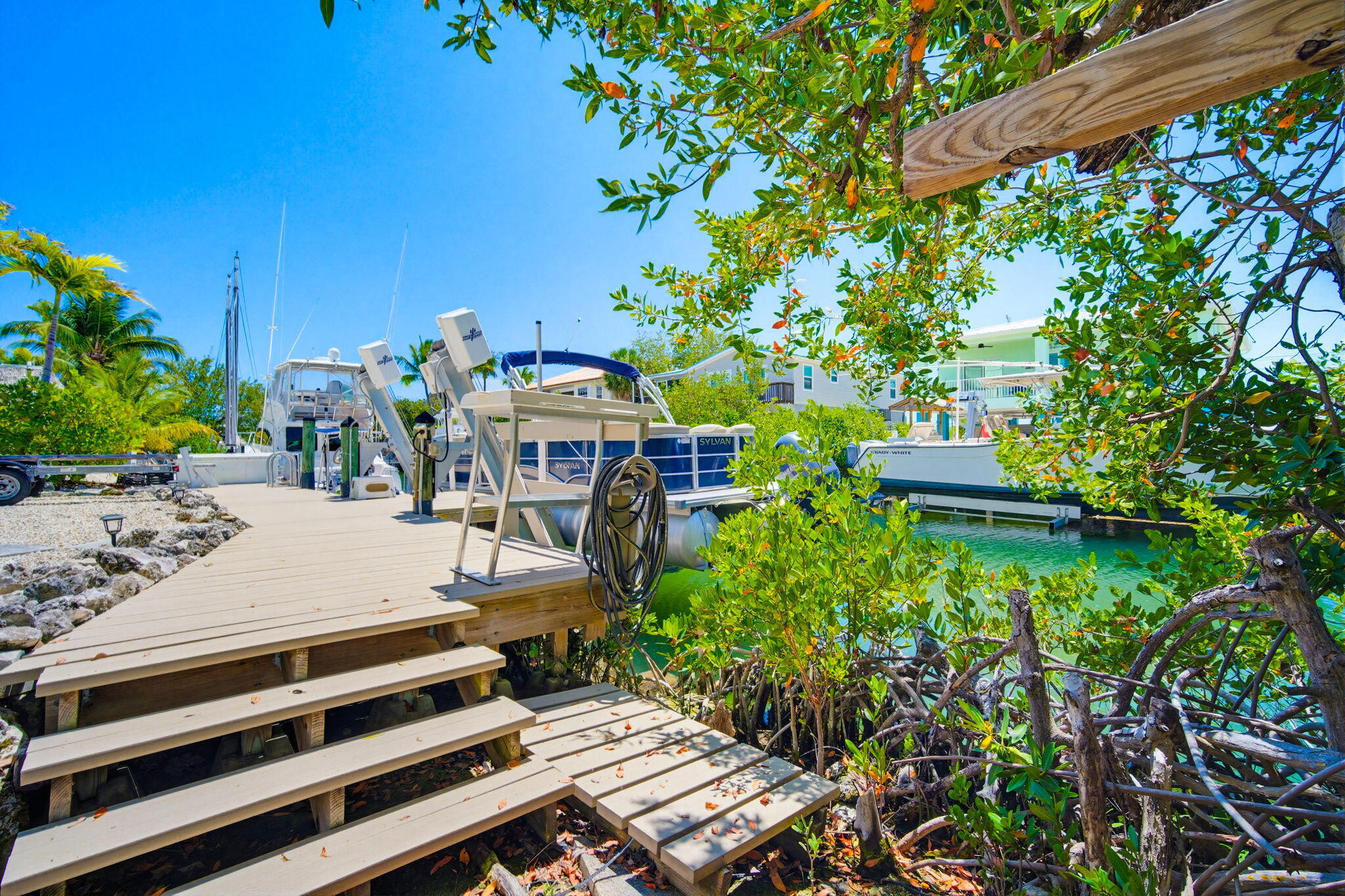 612 Blackbeard Road Summerland Key, FL 33042 - Photo 56 of 68 a view of a patio with table and chairs and potted plants