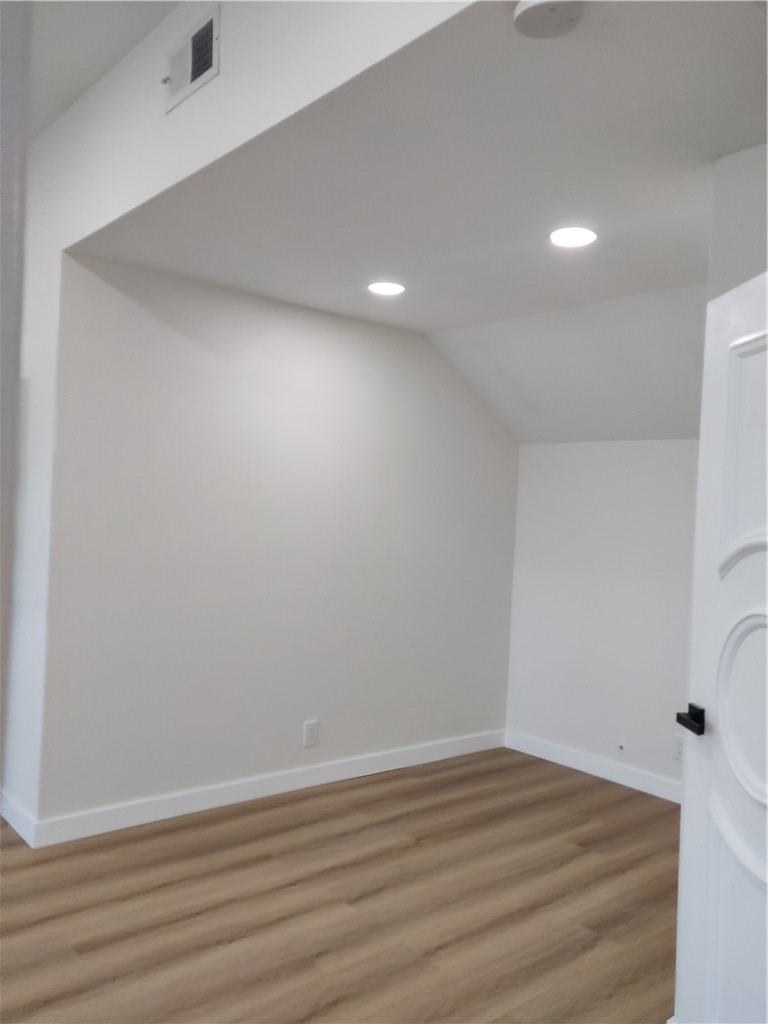 9894 Spruce Court Cypress, CA 90630 - Photo 11 of 22 a view of empty room with wooden floor