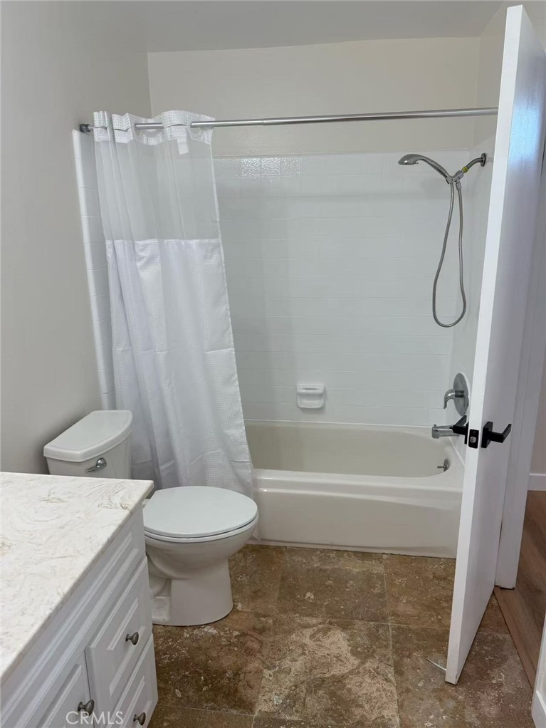 9894 Spruce Court Cypress, CA 90630 - Photo 15 of 22 a bathroom with a sink a toilet and a bathtub