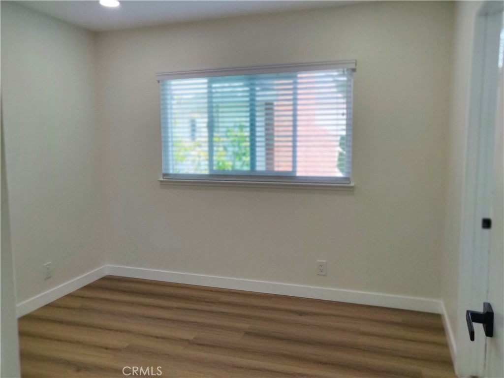 9894 Spruce Court Cypress, CA 90630 - Photo 18 of 22 wooden floor and window in an empty room