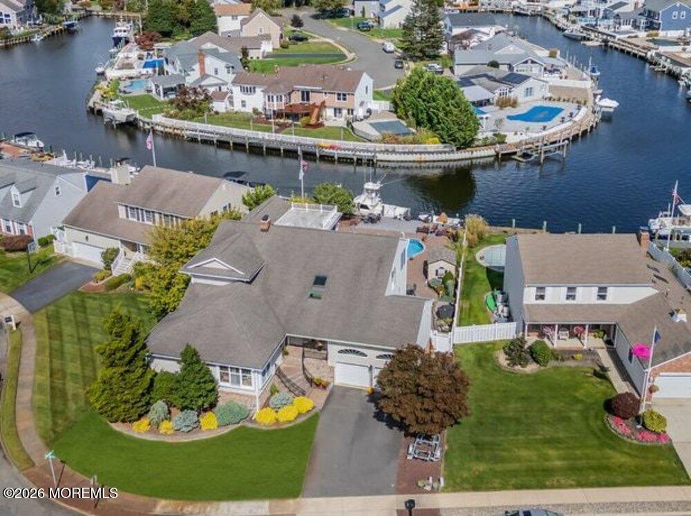 an aerial view of a house with outdoor space