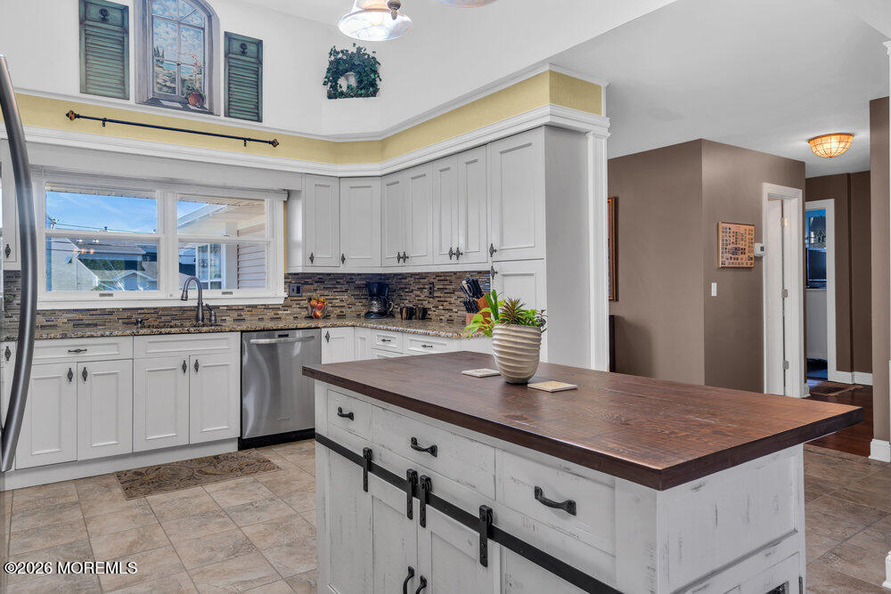 2111 Middle Avenue Point Pleasant, NJ 08742 - Photo 15 of 51 a kitchen with stainless steel appliances granite countertop a stove a sink and a refrigerator