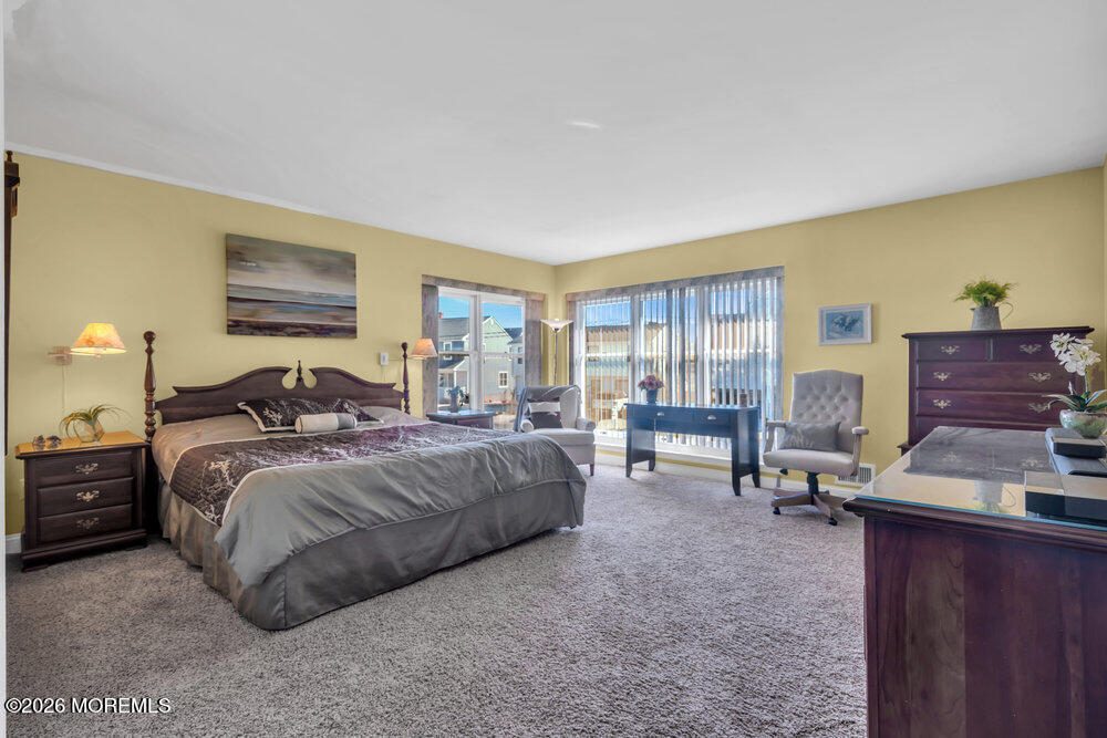 2111 Middle Avenue Point Pleasant, NJ 08742 - Photo 25 of 51 a bed room with a bed and a chair