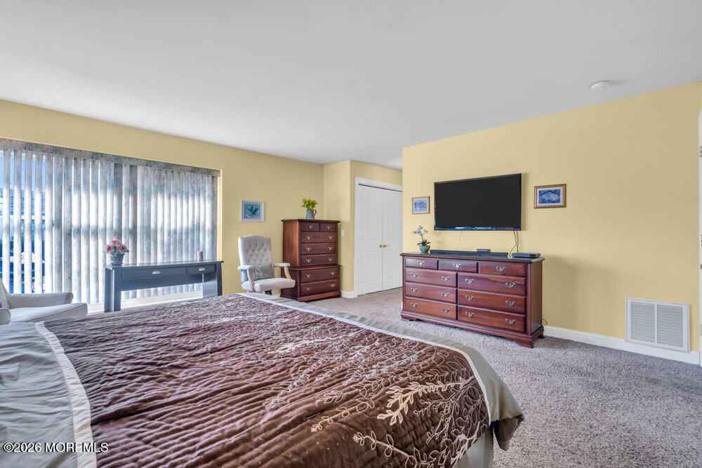 2111 Middle Avenue Point Pleasant, NJ 08742 - Photo 26 of 51 a bedroom with a bed and a flat screen tv