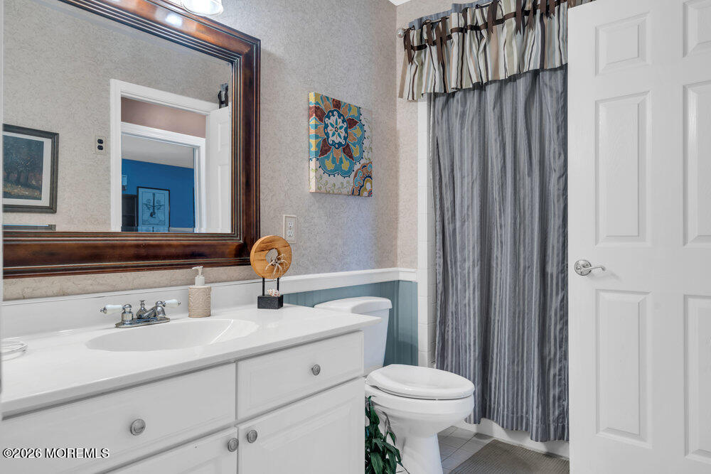 2111 Middle Avenue Point Pleasant, NJ 08742 - Photo 30 of 51 a bathroom with a sink toilet and mirror