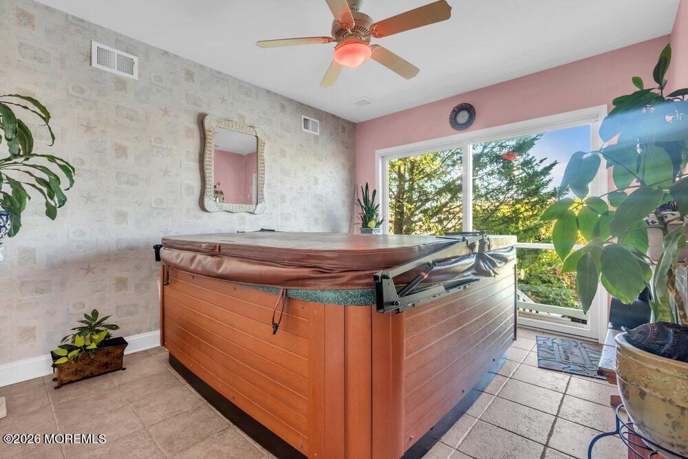 2111 Middle Avenue Point Pleasant, NJ 08742 - Photo 33 of 51 a living room with stainless steel appliances kitchen island granite countertop furniture a rug and a window