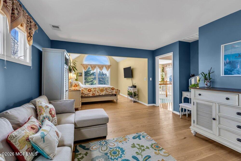 2111 Middle Avenue Point Pleasant, NJ 08742 - Photo 37 of 51 a bedroom with furniture and a wooden floor