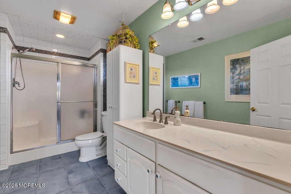 2111 Middle Avenue Point Pleasant, NJ 08742 - Photo 40 of 51 a bathroom with a double vanity sink mirror and toilet