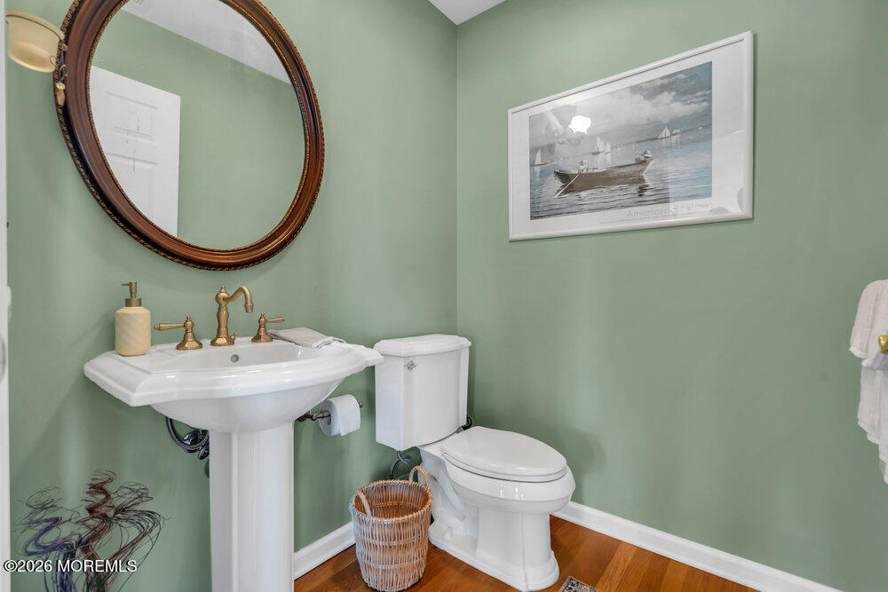 2111 Middle Avenue Point Pleasant, NJ 08742 - Photo 41 of 51 a bathroom with a toilet a sink and a mirror