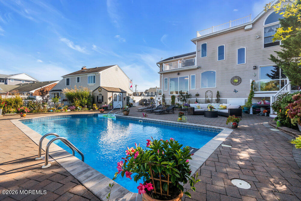 2111 Middle Avenue Point Pleasant, NJ 08742 - Photo 44 of 51 a view of a swimming pool with outdoor seating