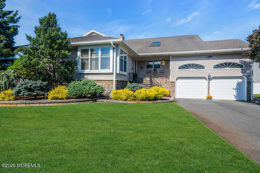 2111 Middle Avenue Point Pleasant, NJ 08742 - Photo 5 of 51 a front view of a house with garden