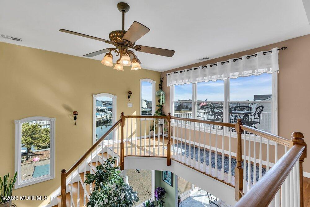 2111 Middle Avenue Point Pleasant, NJ 08742 - Photo 8 of 51 a view of staircase with railing and a chandelier