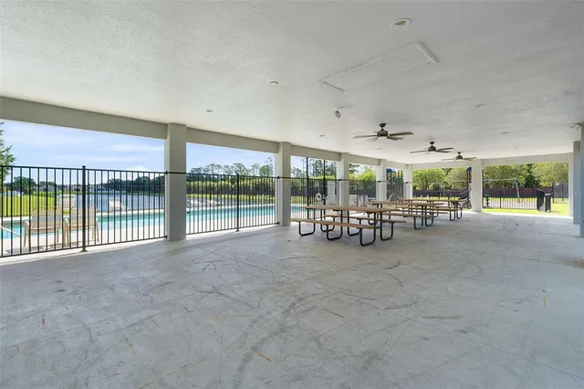 a view of a chairs and table in the room