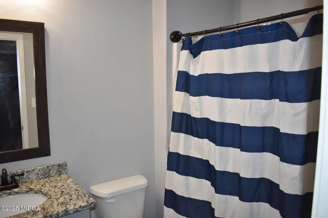 a bathroom with a sink and a toilet