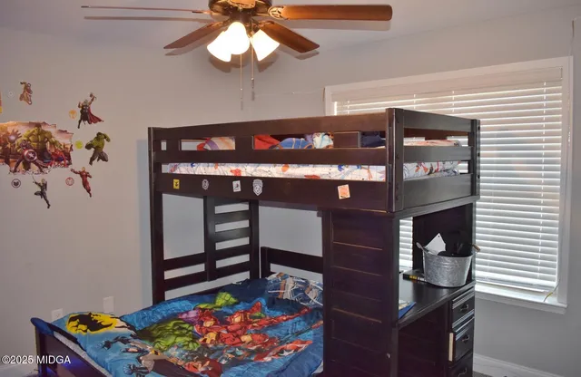 a living room with furniture a dining table and chairs