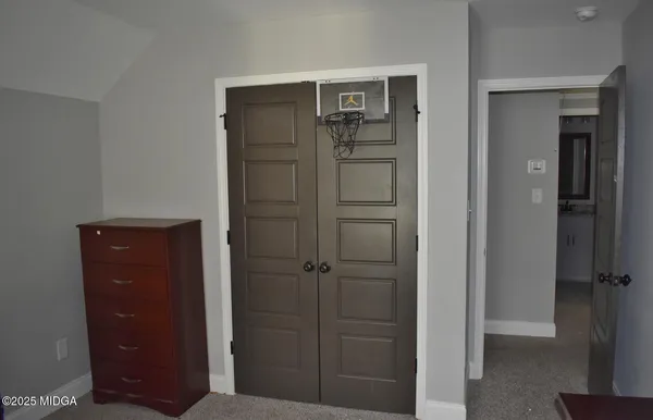 wooden floor and cabinet in closet