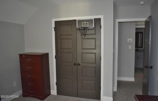 wooden floor and cabinet in closet