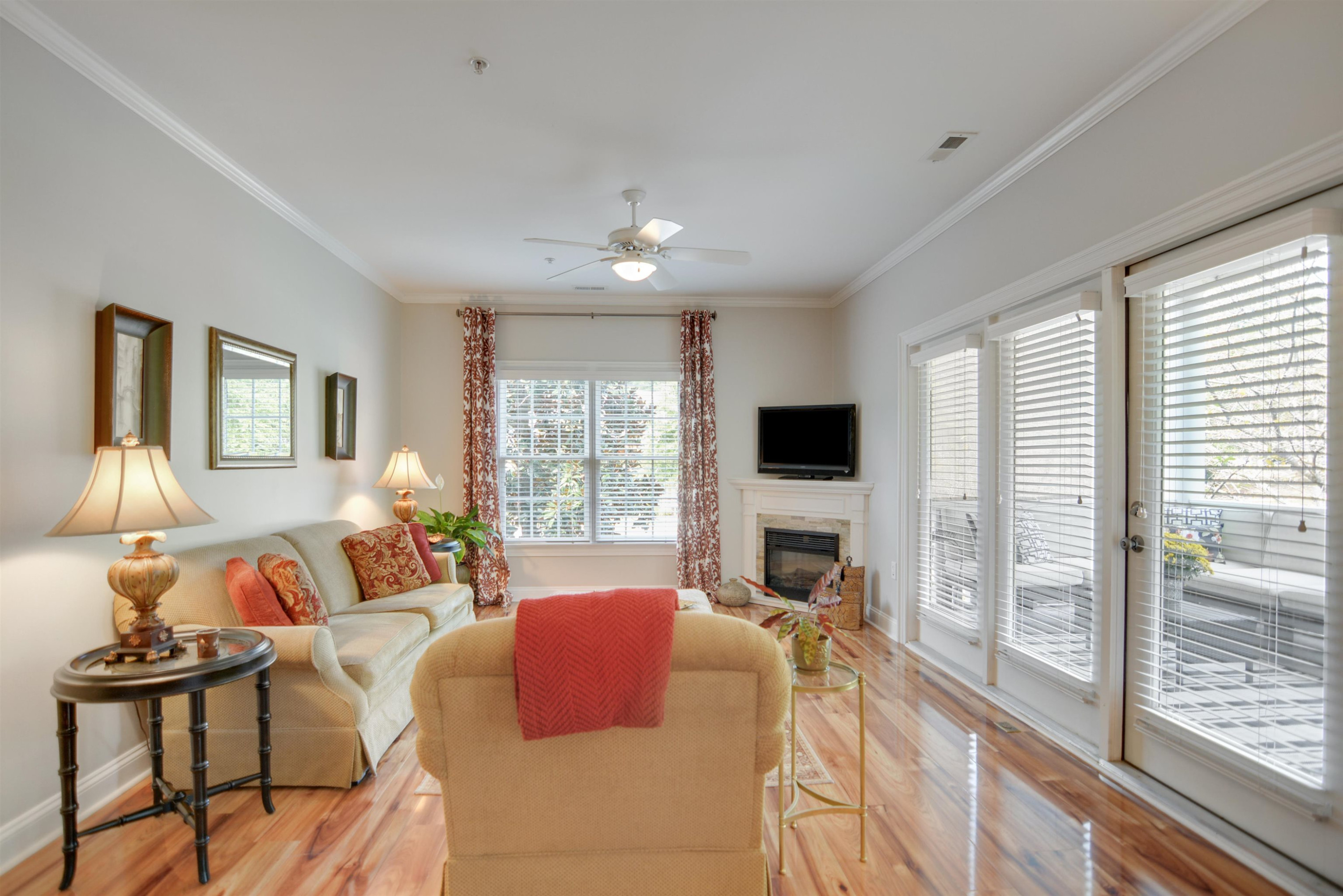 7530 Lead Mine Road, Unit 206 Raleigh, NC 27615 - Photo 3 of 19 a living room with furniture a flat screen tv and a fireplace