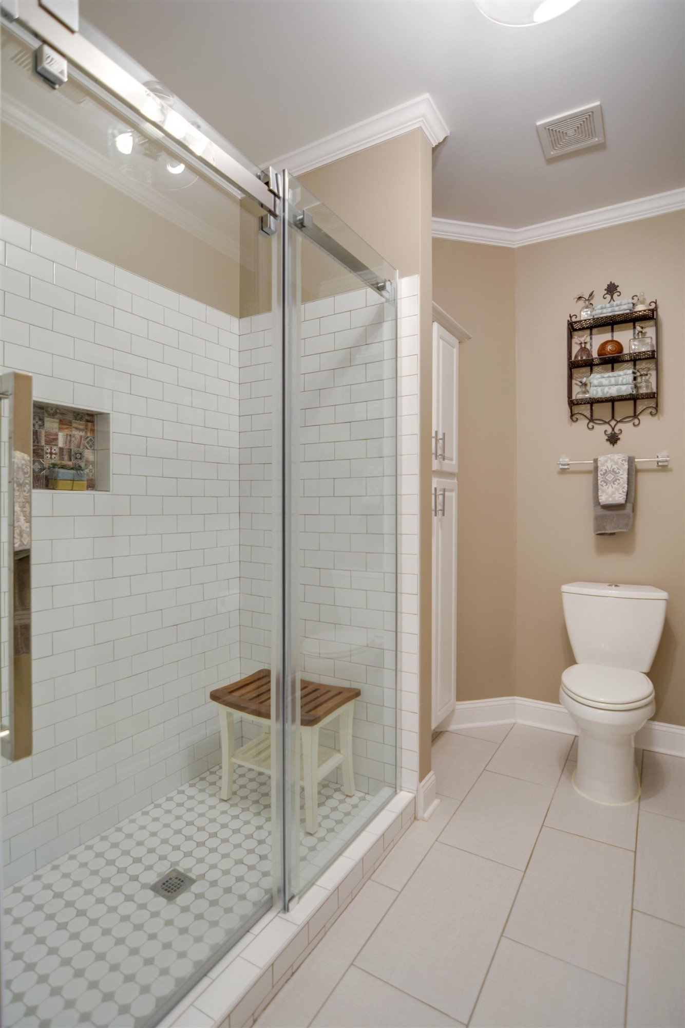 7530 Lead Mine Road, Unit 206 Raleigh, NC 27615 - Photo 10 of 19 a bathroom with a toilet and a shower