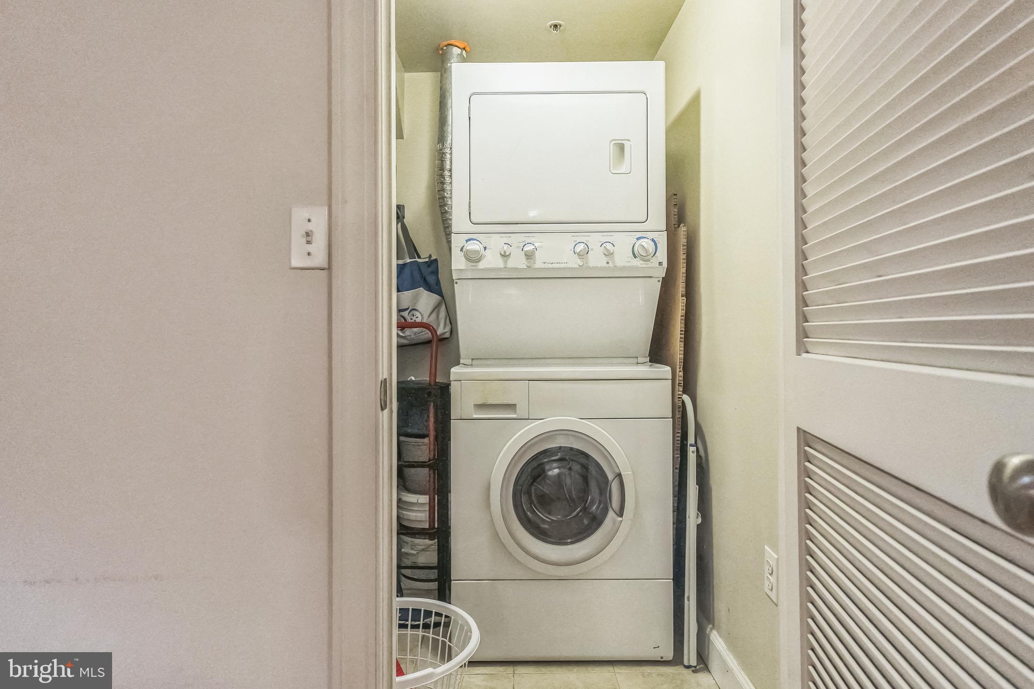 5040 1st Street Northwest, Unit 301 Washington, DC 20011 - Photo 11 of 22 a utility room with dryer and washer