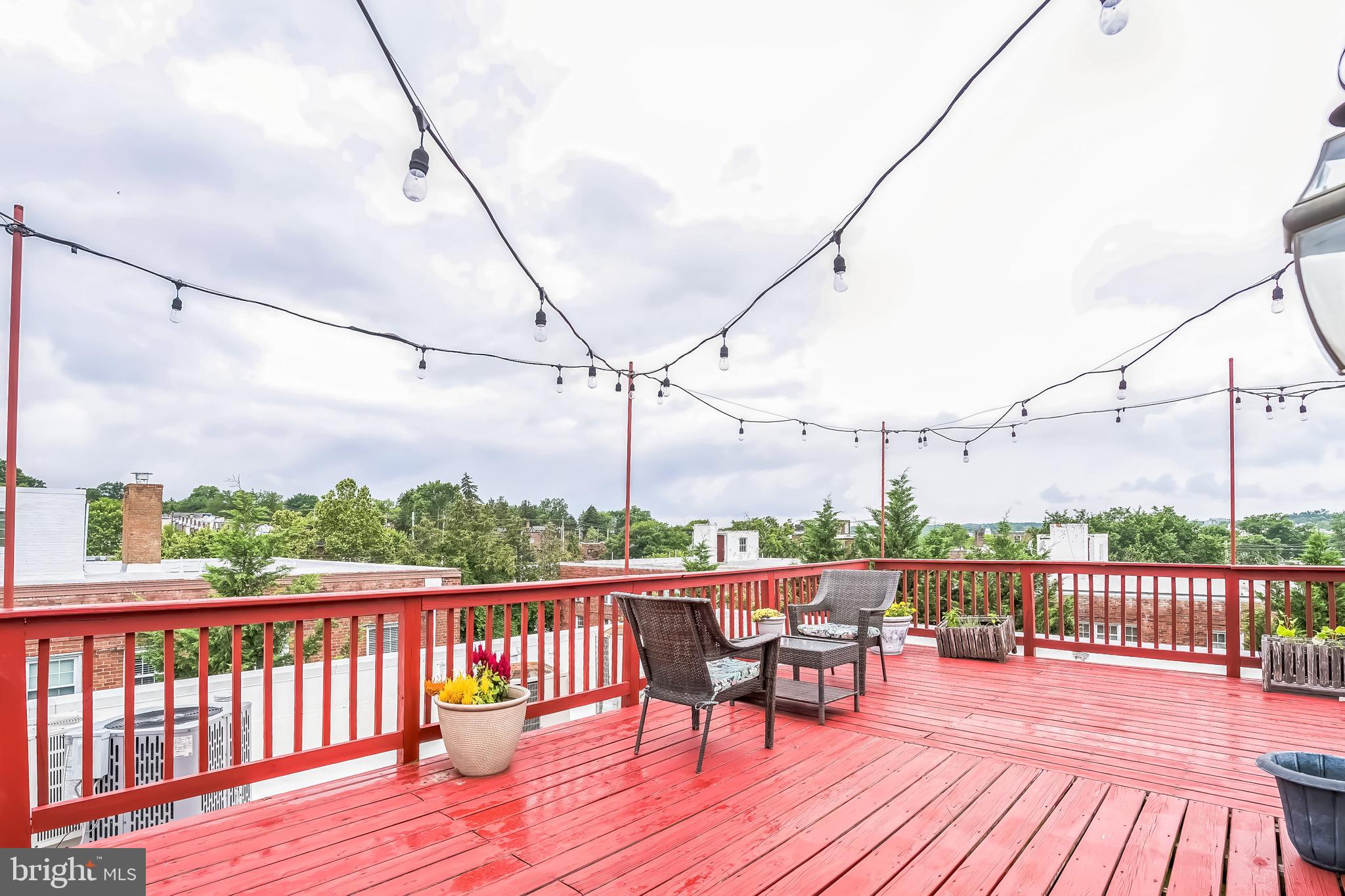 5040 1st Street Northwest, Unit 301 Washington, DC 20011 - Photo 18 of 22 a view of deck with chairs wooden floor and fence