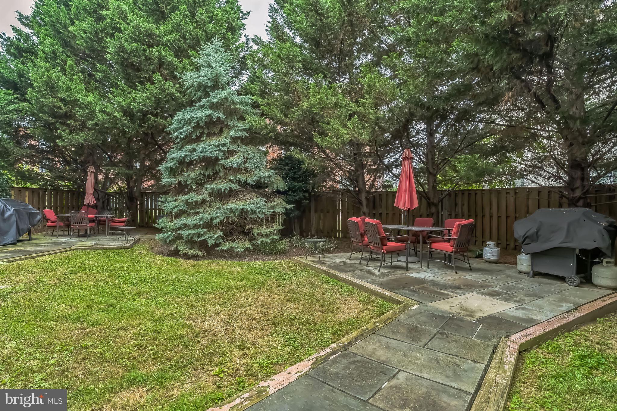 5040 1st Street Northwest, Unit 301 Washington, DC 20011 - Photo 19 of 22 a view of a backyard with a patio and fire pit